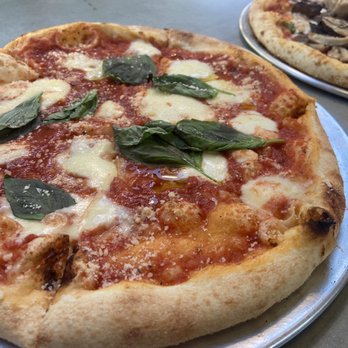 P!ZZA -  two pizzas on a table - Pizza Near Me - Bend, Oregon