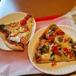 Sausage, onions and peppers on the right and spinach and tomatoes on the left. Sausage, onions and peppers on the right and spinach and tomatoes on the left.