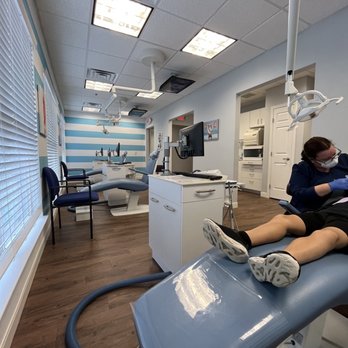 Shoemaker Pediatric Dentistry - Each station has a tv playing fun movies for the patients - Pediatric Dentists Near Me - Kennesaw, Georgia Shoemaker Pediatric Dentistry - Each station has a tv playing fun movies for the patients - Pediatric Dentists Near Me - Kennesaw, Georgia