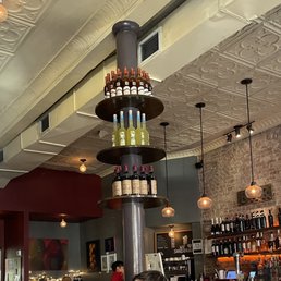 a bar with people sitting at the bar