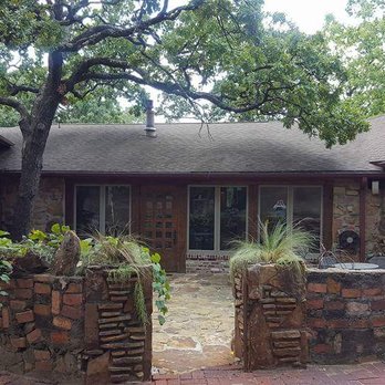 Cedar Rock Inn - Courtyard to the Sage and an entrance to the inn. - Hotels Near Me - Tulsa, Oklahoma