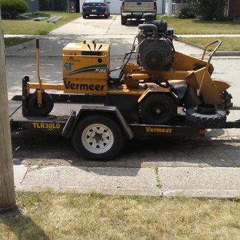 Painless Stump Grinding - This stump grinder weighs the same as a riding mower so it won't damage the lawn and it can fit into small openings of 36" - Tree Services Near Me