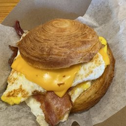 Breakfast sandwich on a croissant with bacon. Elite. Breakfast sandwich on a croissant with bacon. Elite.