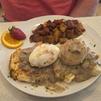 Salt and Honey - Chicken Benedict.  Biscuits (exceptional), poached eggs, and incredible sausage gravy. Cowboy potatoes on the side. - Breakfast & Brunch Near Me - Virginia Beach, Virginia