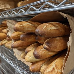 Bleecker and Greer - Fresh baguettes getting ready to come up from the bakery