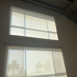 Two roller shades installed. 10' x 8' windows with the top being ~20 feet above the floor. Two roller shades installed. 10' x 8' windows with the top being ~20 feet above the floor.