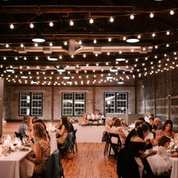 Olio - Wedding dinner under twinkle lights at Olio modern event space in Peabody, north of Boston Massachusetts