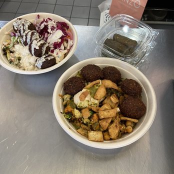 Anzo - Bowl with falafel, tehina, pita chips, etc. The side of dolmas. - Mediterranean Near Me - Boynton Beach, Florida