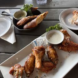 Wings barbecue and Parmesan pretezels and artichoke dip