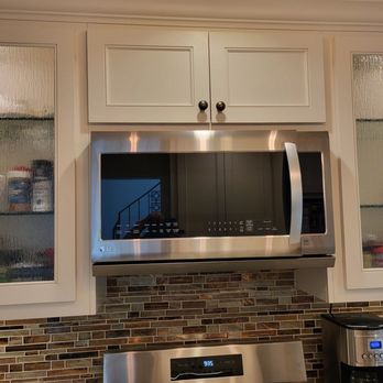 R & R Contractors - Before picture with an old microwave with gross vents underneath. - Handyman Near Me