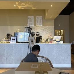 Coffee bar and register area (restrooms to the right hallway)