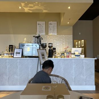 Larcomar Cafe Lounge - Coffee bar and register area (restrooms to the right hallway) - Coffee & Tea Near Me - Manassas Park, Virginia
