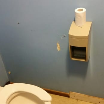 Astorga's Mexican Restaurant - They couldn't be bothered to put the toilet paper in the dispenser. I love the piece of unfinished wood nailed on as a base board. - Mexican Near Me - Bishop, California