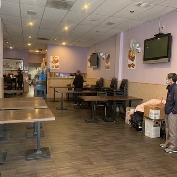 S & E Cafe - a man standing in a waiting area - Chinese Near Me - San Francisco, California