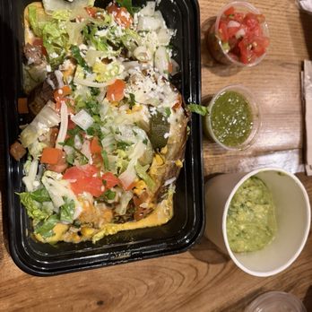 George Lopez's Chingon Kitchen - The baked potato! The works ! Added extra veggies and a side of guac, too. Got a couple of salsas to add! Yum e! - Mexican Near Me - Highland, California
