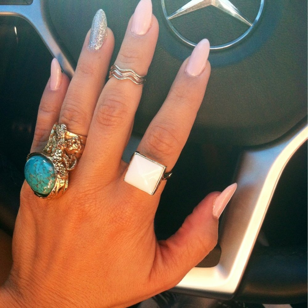 Almond nails with glitter ring finger. Almond nails with glitter ring finger.