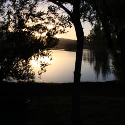 Twin Pines Rv Park & Campgrounds - The evening view from our tent site. All tenting sites are along this waterfront. Gorgeous!