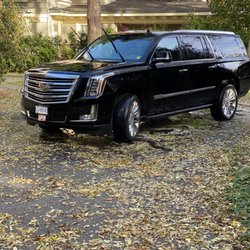 Vanlimo Limousine Service - Black Platinum Cadillac Escalade SUV with Captain seats.