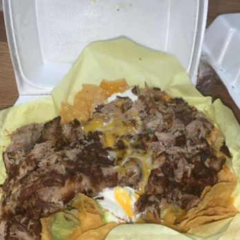 El Forastero - Carnitas Super Nachos w/ sour cream, guacamole, chips, and cheese - Mexican Near Me - Sacramento, California El Forastero - Carnitas Super Nachos w/ sour cream, guacamole, chips, and cheese - Mexican Near Me - Sacramento, California
