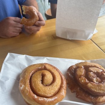 Ye Olde Donut Shoppe - Cinnamon roll on the left and the raspberry roll on the right. Glazed also pictured. - Donuts Near Me - Champaign, Illinois