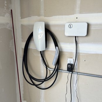 C. Bates Electric - Tesla wall charger cleanly/perfectly installed in the garage (ignore the sprinkler timer on the right, that was my doing). - Electricians Near Me - Fairfield, California C. Bates Electric - Tesla wall charger cleanly/perfectly installed in the garage (ignore the sprinkler timer on the right, that was my doing). - Electricians Near Me - Fairfield, California