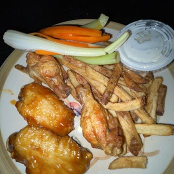Wingstop - a plate of chicken wings, french fries, carrots and celery - Chicken Wings Near Me - Frederick, Maryland