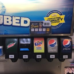 a soda dispenser in a grocery store a soda dispenser in a grocery store