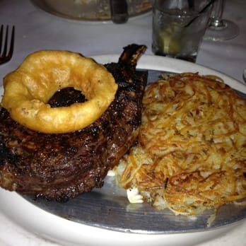 Tornado Steak House - Perfect medium rare bone in ribeye with hash towns - Steakhouses Near Me - Madison, Wisconsin