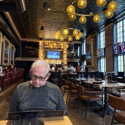 The Kennedy - We could see the intimate tables in balcony overlooking the bar. See how the TVs are not intrusive to the elegant old world decor