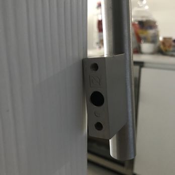 Italkraft - They were supposed to have used 3 screws to properly and securely affix the door pull. They got lazy and only used 1 short screw - Kitchen & Bath Near Me - Doral, Florida