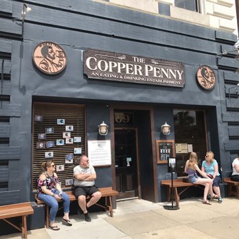 Copper Penny - a group of people sitting outside of a building - American Near Me - Wilmington, North Carolina Copper Penny - a group of people sitting outside of a building - American Near Me - Wilmington, North Carolina