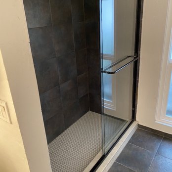 United Top Quality Construction - White shower floor and curb - General Contractors Near Me
