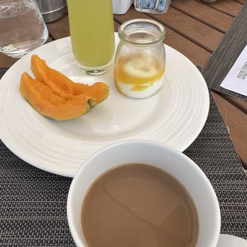Plumeria Beach House - To start. Some papaya, lilikoi mascarpone w dried fruit added, a glass of pineapple mint juice + coffee. - Breakfast & Brunch Near Me - Honolulu, Hawaii Plumeria Beach House - To start. Some papaya, lilikoi mascarpone w dried fruit added, a glass of pineapple mint juice + coffee. - Breakfast & Brunch Near Me - Honolulu, Hawaii