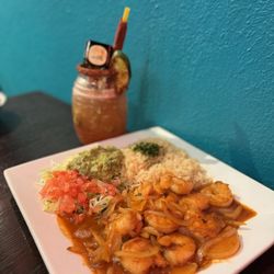 Taco Quila Mexican Kitchen And Cantina - Camarones al Ajo - Shrimp in a Garlic Sauce and the drink is a pepino barrilito