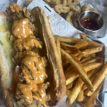 Ocean 7 Boiling Seafood & Bar - Fried oyster po-boy with Cajun fries. - Seafood Near Me - Olympia, Washington Ocean 7 Boiling Seafood & Bar - Fried oyster po-boy with Cajun fries. - Seafood Near Me - Olympia, Washington