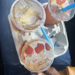 Strawberry tea w passion fruit popping boba, grapefruit tea w mango popping pearls, and a strawberry tea w mango popping boba Strawberry tea w passion fruit popping boba, grapefruit tea w mango popping pearls, and a strawberry tea w mango popping boba