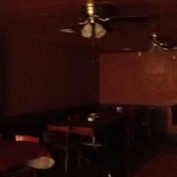Mi Pueblo - a dining room with a ceiling fan - Mexican Near Me
