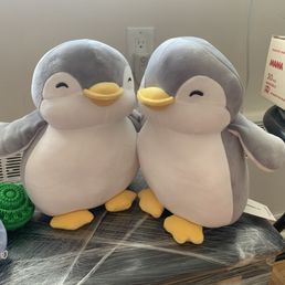 2 penguin plushies