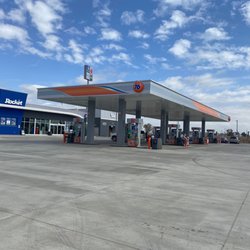 Rocket - Exterior of the gas station and gas pumps
