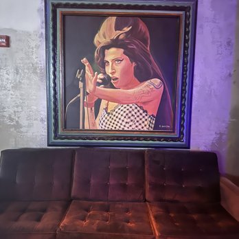 Mercury Ballroom - a painting of a woman playing a guitar - Music Venues Near Me - Louisville, Kentucky Mercury Ballroom - a painting of a woman playing a guitar - Music Venues Near Me - Louisville, Kentucky