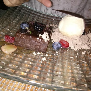Stage Restaurant - The Very Decadent Cake. My friend insisted on photo bombing. - New American Near Me - Honolulu, Hawaii Stage Restaurant - The Very Decadent Cake. My friend insisted on photo bombing. - New American Near Me - Honolulu, Hawaii