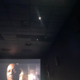 The lights above us still on during the movie..