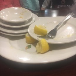 Plates piled up for 25 minutes.  Couldn't get anyone to come clear them or refill us with water