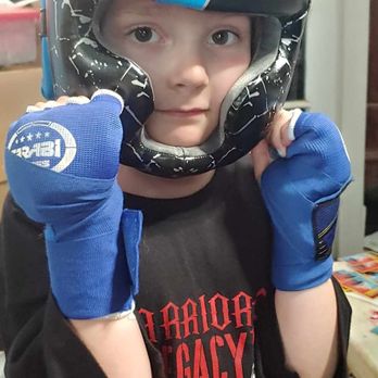 Warriors Legacy Martial Arts - Photo by me. Showing off her knew helmet, gloves and shirt. - Muay Thai Near Me - Paris, Texas Warriors Legacy Martial Arts - Photo by me. Showing off her knew helmet, gloves and shirt. - Muay Thai Near Me - Paris, Texas
