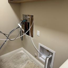 Repair of pipes behind washer. Repair of pipes behind washer.
