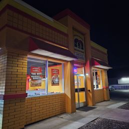The front of the Ellensburg location of Mucho Gracias mexican food restaurant taken at night
