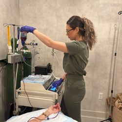 IV Elements - An IV Elements team member preparing equipment for a client's ozone therapy session.