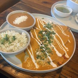 Enchiladas with house made red chile and pistachio sauce