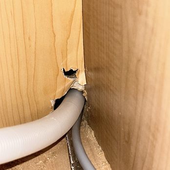 Veteran Plumbing Services - The "hole" their employee drilled in a new kitchen cabinet. - Plumbing Near Me Veteran Plumbing Services - The "hole" their employee drilled in a new kitchen cabinet. - Plumbing Near Me