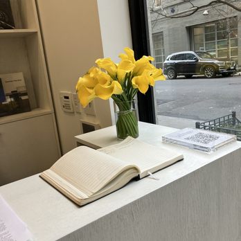 Susan Inglett Gallery - Desk with yellow canna lilies - Art Galleries Near Me - Manhattan, New York Susan Inglett Gallery - Desk with yellow canna lilies - Art Galleries Near Me - Manhattan, New York